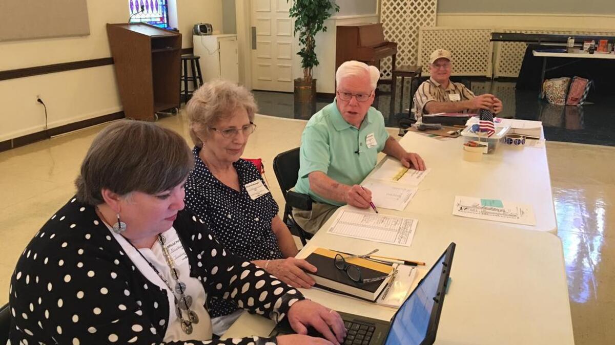 Pollworkers at Cary Lake’s North Trenholm Road precinct at North Trenholm Baptist Church were ready for voters in Tuesday’s dam referendum. They are, left to right: Martha Copeland, Sandra Funderburk, David Thompson and Larry Funderburk.