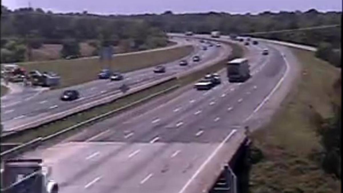 An overturned tractor-trailer is blocking the ramp from Bluff Road to Interstate 77.