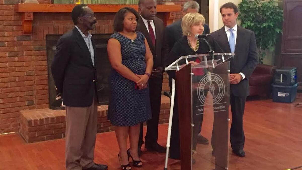 
Columbia City Councilwoman Leona Plaugh announces she is cancer-free after having her right leg amputated. Joining her are, from left, council members Sam Davis, Tameika Isaac Devine, Mayor Steve Benjamin, Moe Baddourah and Cameron Runyan.
