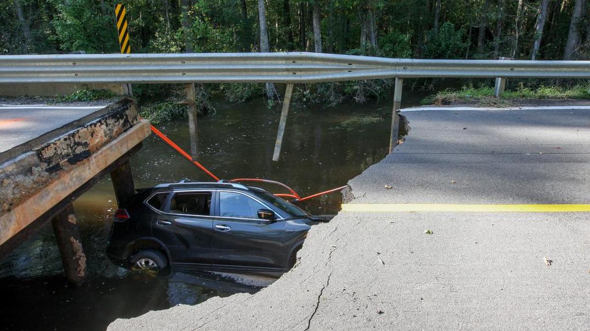
A car lies in Myers Creek in Hopkins, where the bridge on Lower Richland Boulevard collapsed.
