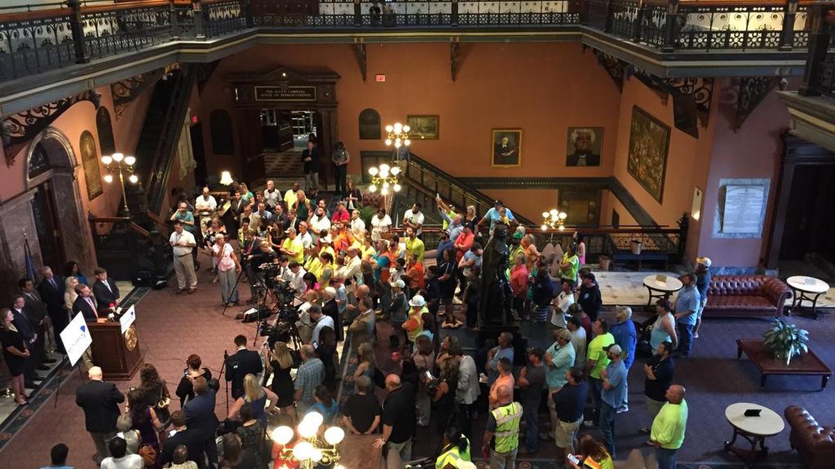 State lawmakers address an angry crowd recently in the wake of a nuclear project abandonment that left ratepayers questioning whether they would get their money back for the bungled construction effort.