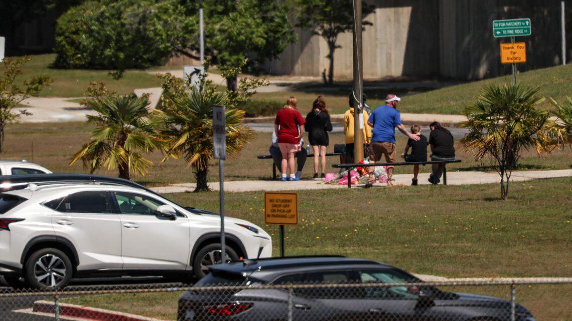 People gather at Pine Ridge Middle School on April 18, 2025 to mourn Jose Maria Gonzalez-Linares, a 13-year-old student who was killed in a school bus crash the day before.
