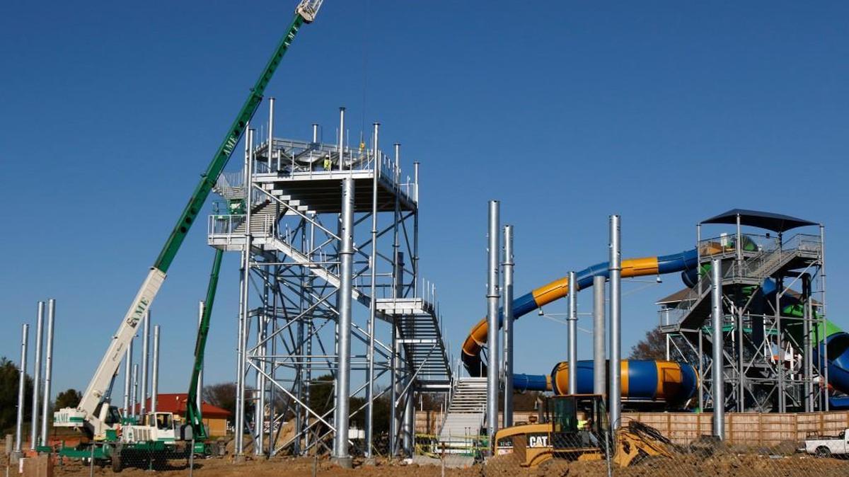 A tour of the Carolina Harbor Waterpark under construction at Carowinds Wednesday. Blackbeard’s Revenge, a six-story water slide complex that features six slides, is going up in the newly expanded water park.