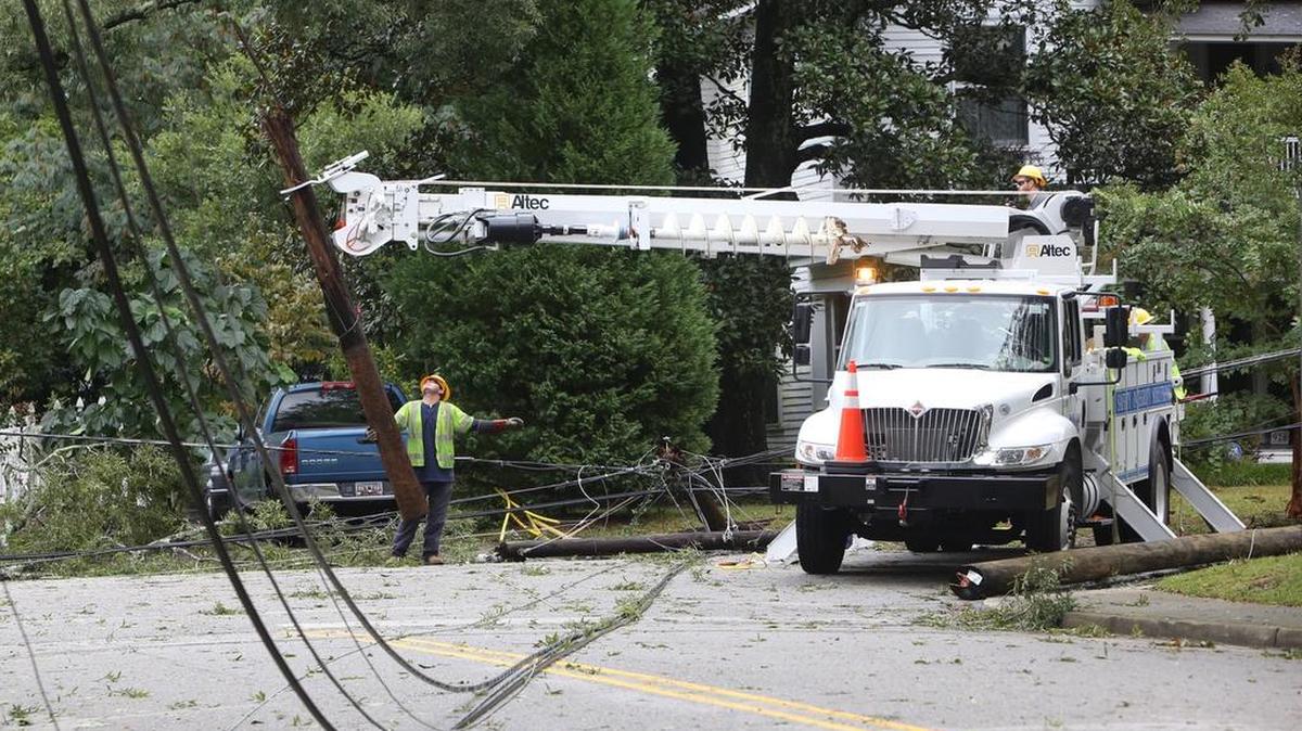 Crews work to restore power at Maple and Cypress after a tree fell and damaged lines.