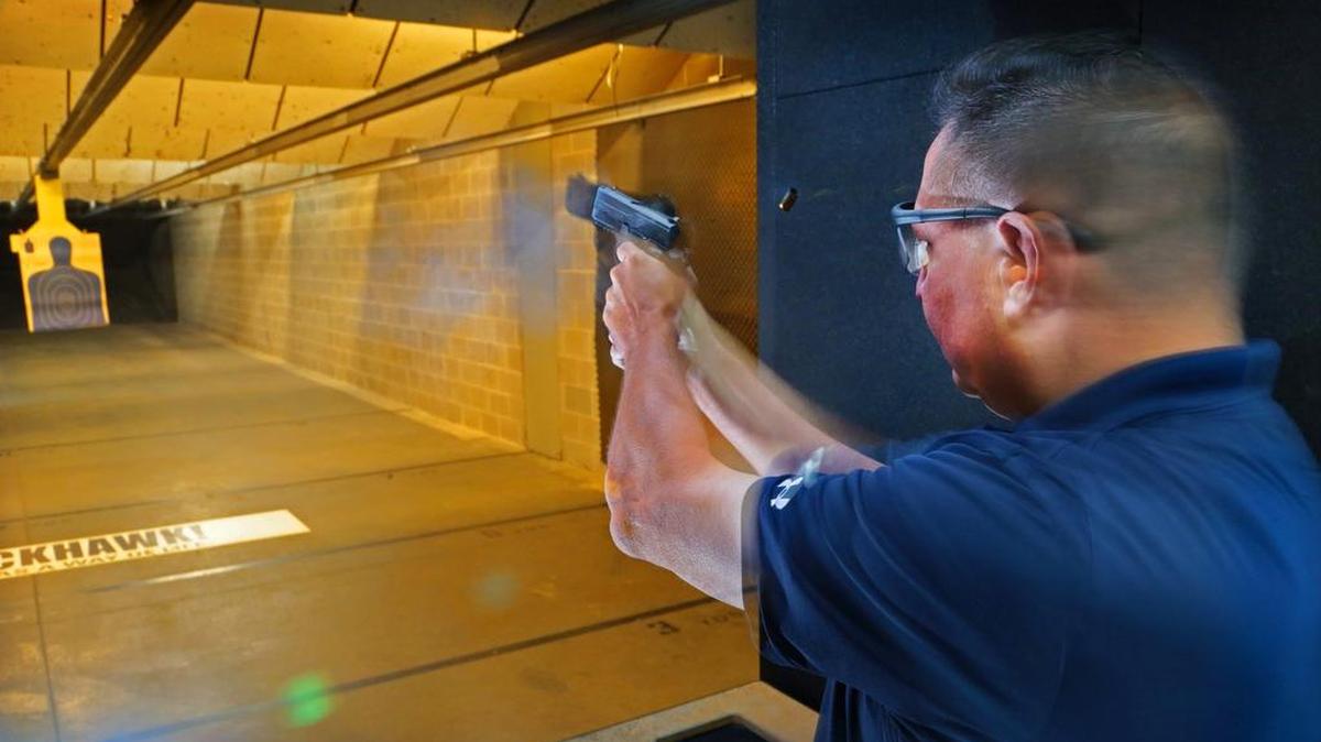 Eleventh Circuit solicitor candidate Larry Wedekind shoots his pistol as he goes through target practice at Palmetto State Armory last week. Wedekind is an avid target shooter.