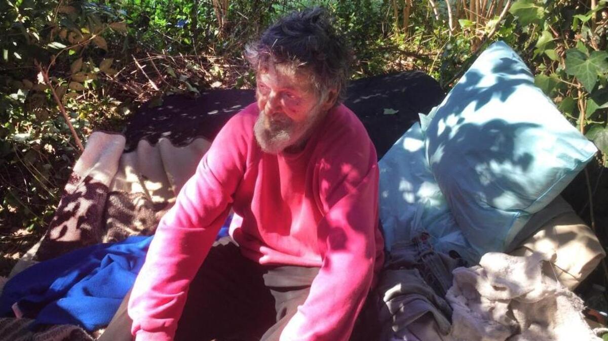 Homeless veteran Danny Wayne Henry sits in a makeshift camp Thursday.