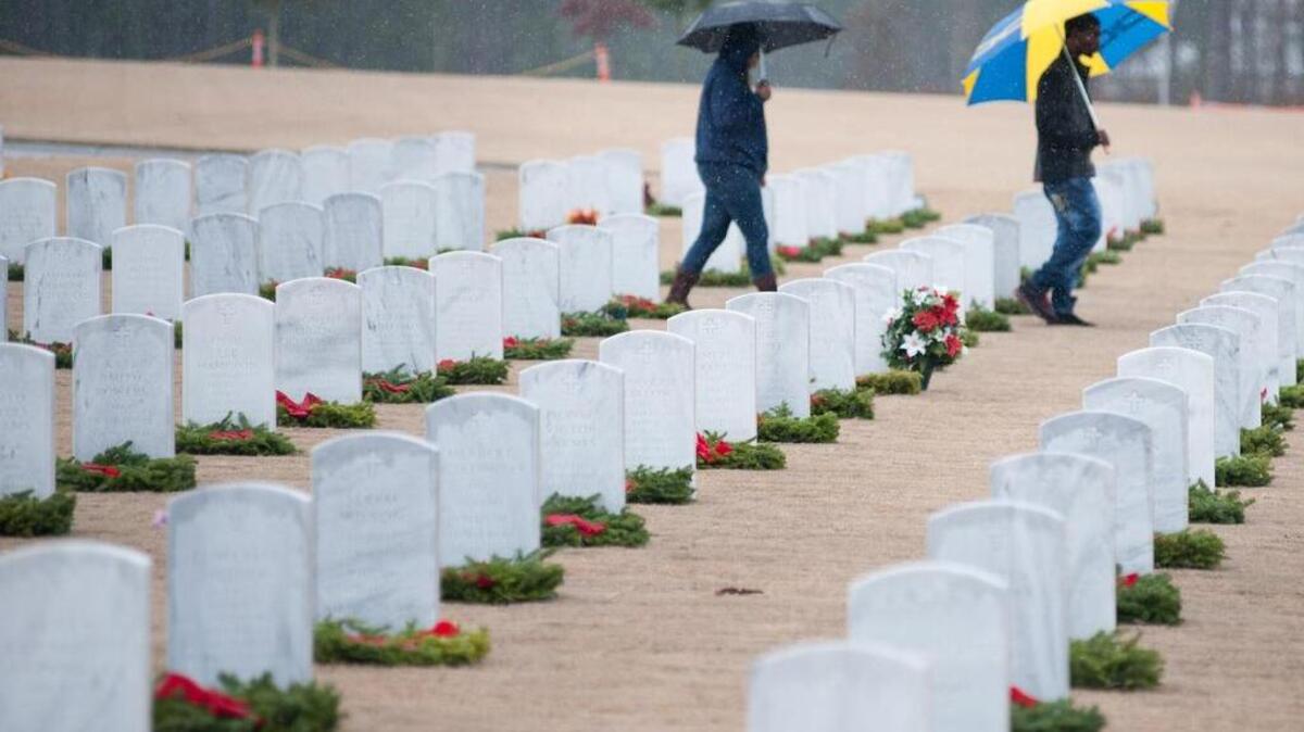 A couple hundred people gathered in December 2014 at the Fort Jackson National Cemetery to place wreaths an the headstones of 2500 graves.