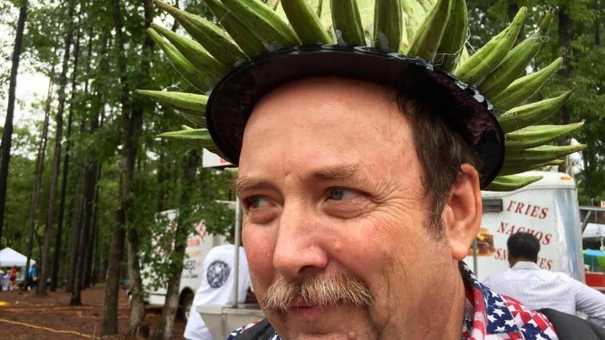 
Dwayne Schumpert dresses in okra garb each year for the annual Okra Strut festival. 
