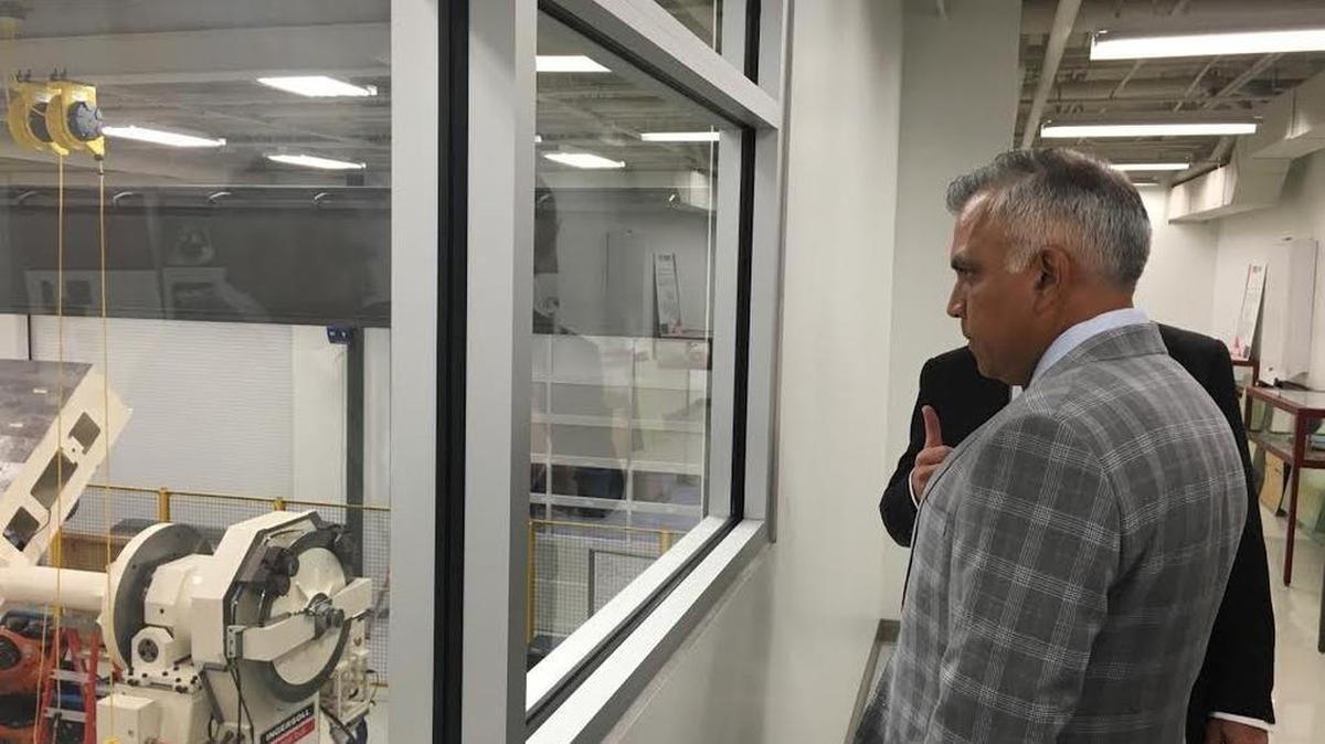 Raj Batra, an executive with Siemens Corp., looks over an engineering laboratory at the University of South Carolina.