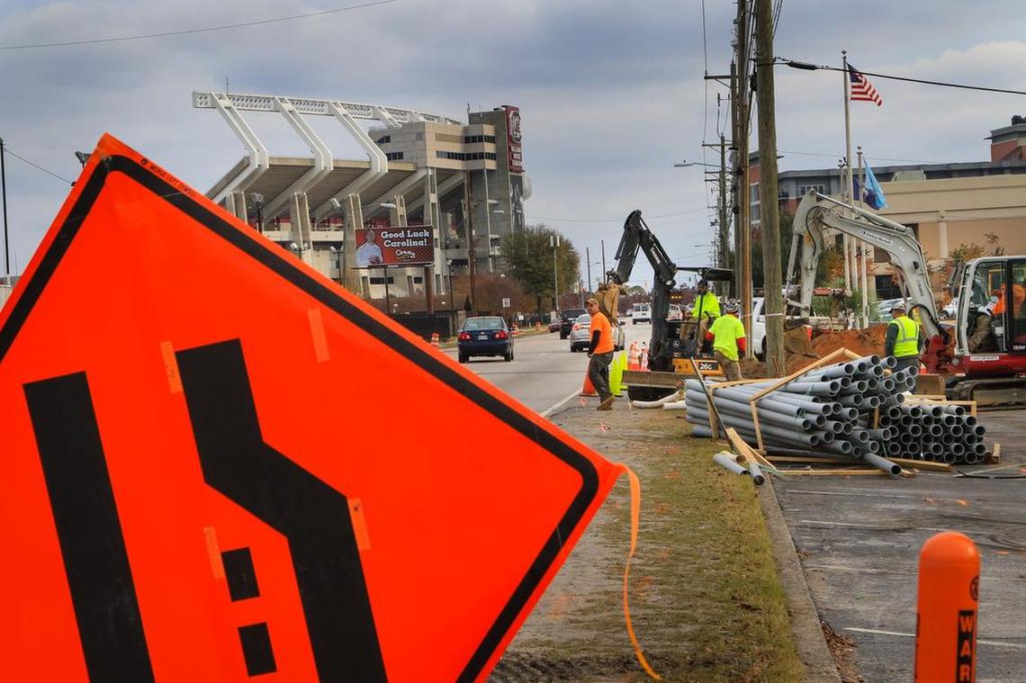 In this file photo, construction crews work to widen Bluff Road and bury power lines.