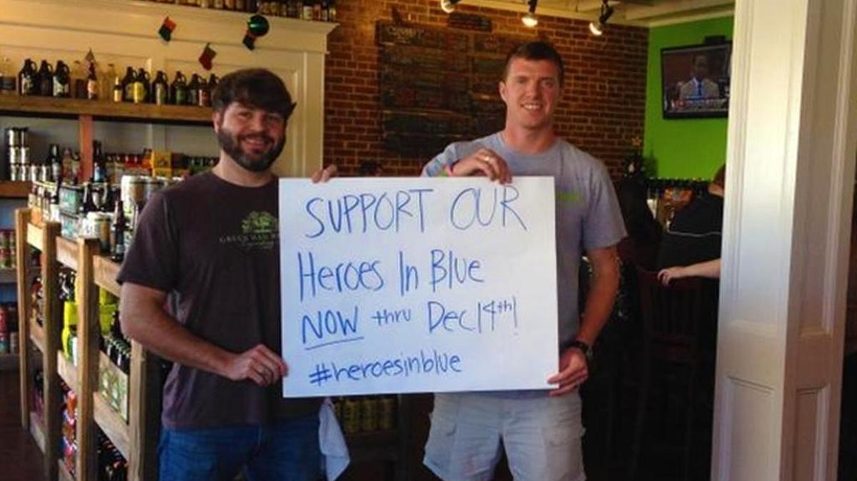 Kellan Monroe and Andrew Johnson of Craft and Draft on Devine Street show support for Heroes in Blue.
