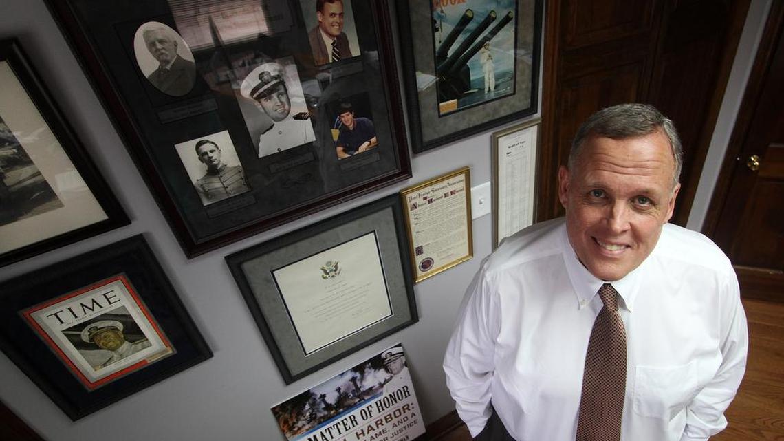 Manning Kimmel stands next to photographs of his family, including his grandfather, Admiral Husband Kimmel. Husband Kimmel was initially accused of dereliction of duty after the Dec. 7, 1941, attack on Pearl Harbor. Manning Kimmel of Rock Hill is continuing his efforts to have his grandfather’s name cleared.