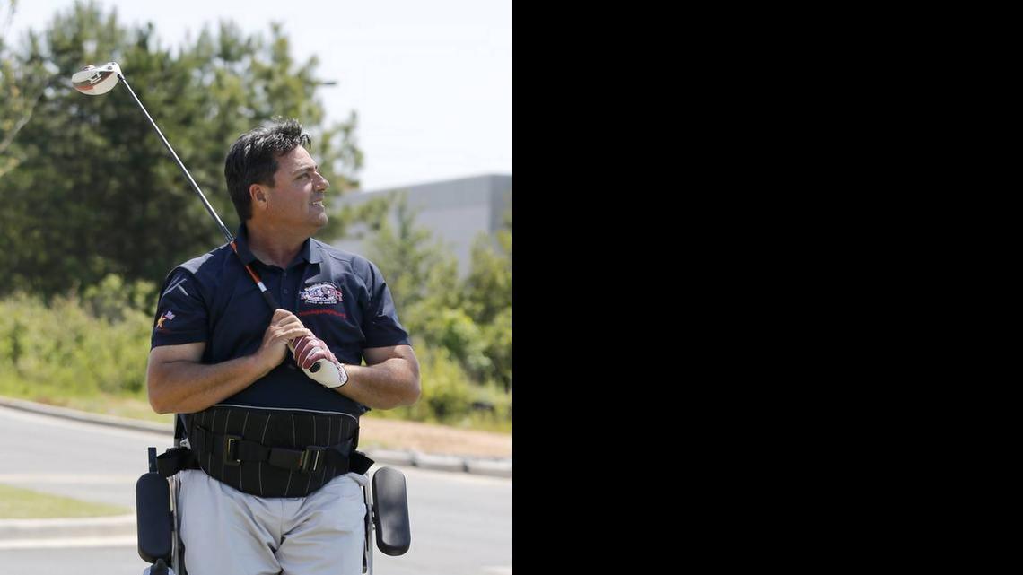 
Anthony Netto with the Stand Up and Play Foundation demonstrates a Paramobile at Hardees on Gold Hill Road in Fort Mill Tuesday. The Paramobile allows Netto to stand to play golf or other sports.
