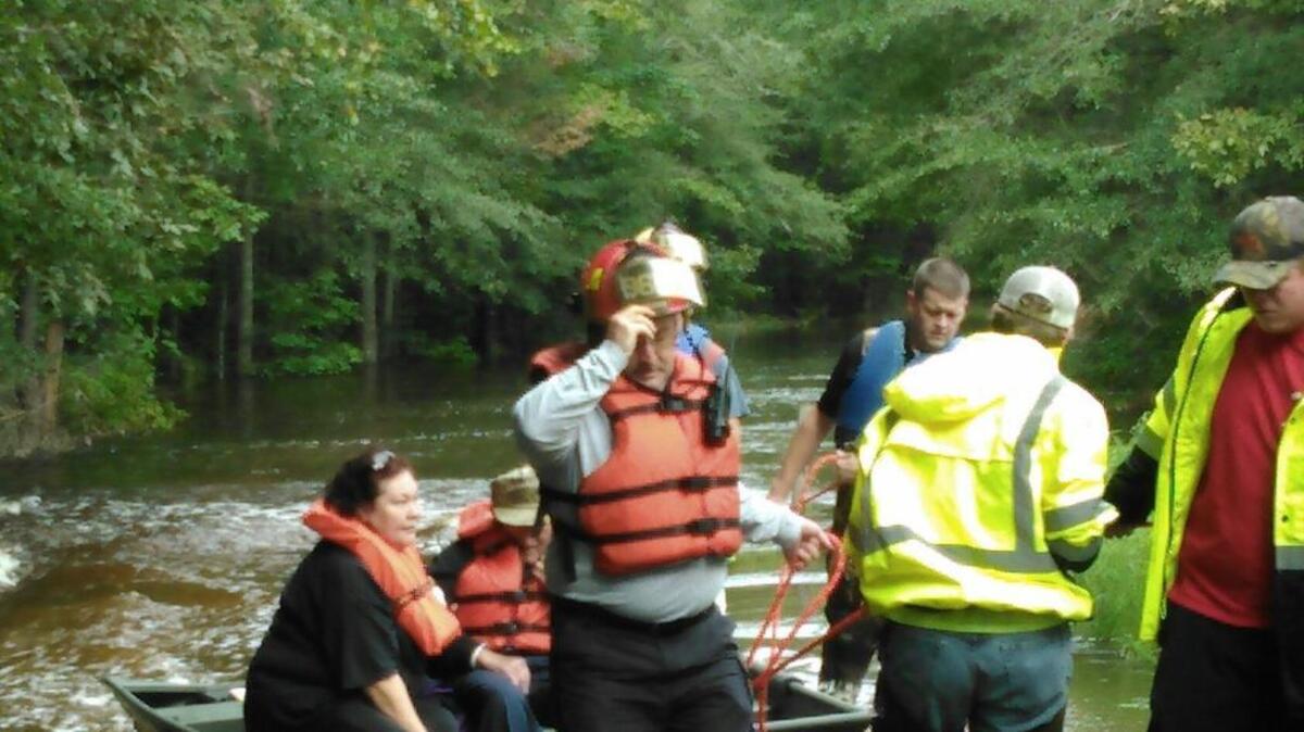 
Officers with the Orangeburg County Sheriff's Office, Orangeburg County Emergency Services, Branchville and Rowesville fire departments pulled a family of three to safety near Branchville on Tuesday, Oct. 6. The family was surrounded by waters overflowing from the North Edisto River.
