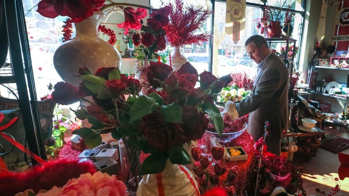 A shopper peruses the flowers at Something Special florist shop on Main Street.