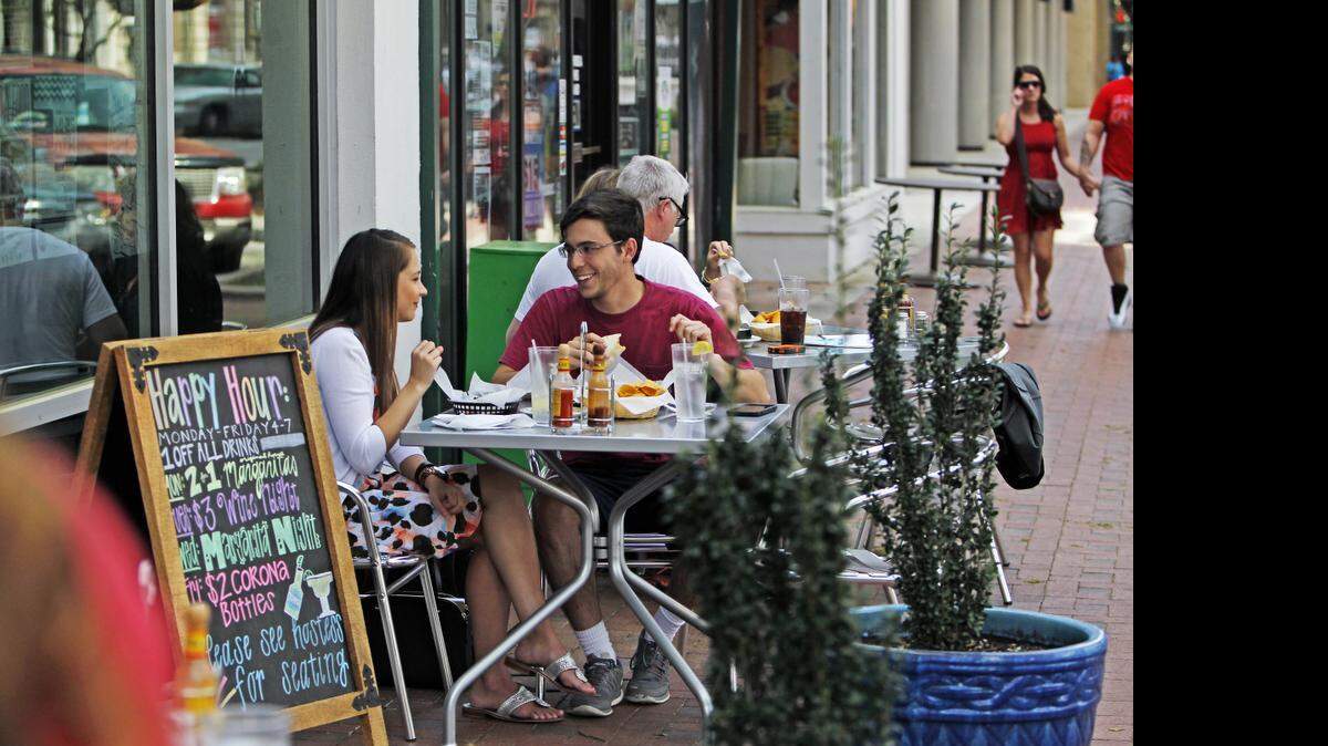 
Brea Robinson and Vincent Statuto enjoy Happy Hour at Cantina 76 on Main Street, a block from the State House, in downtown Columbia in early April.
