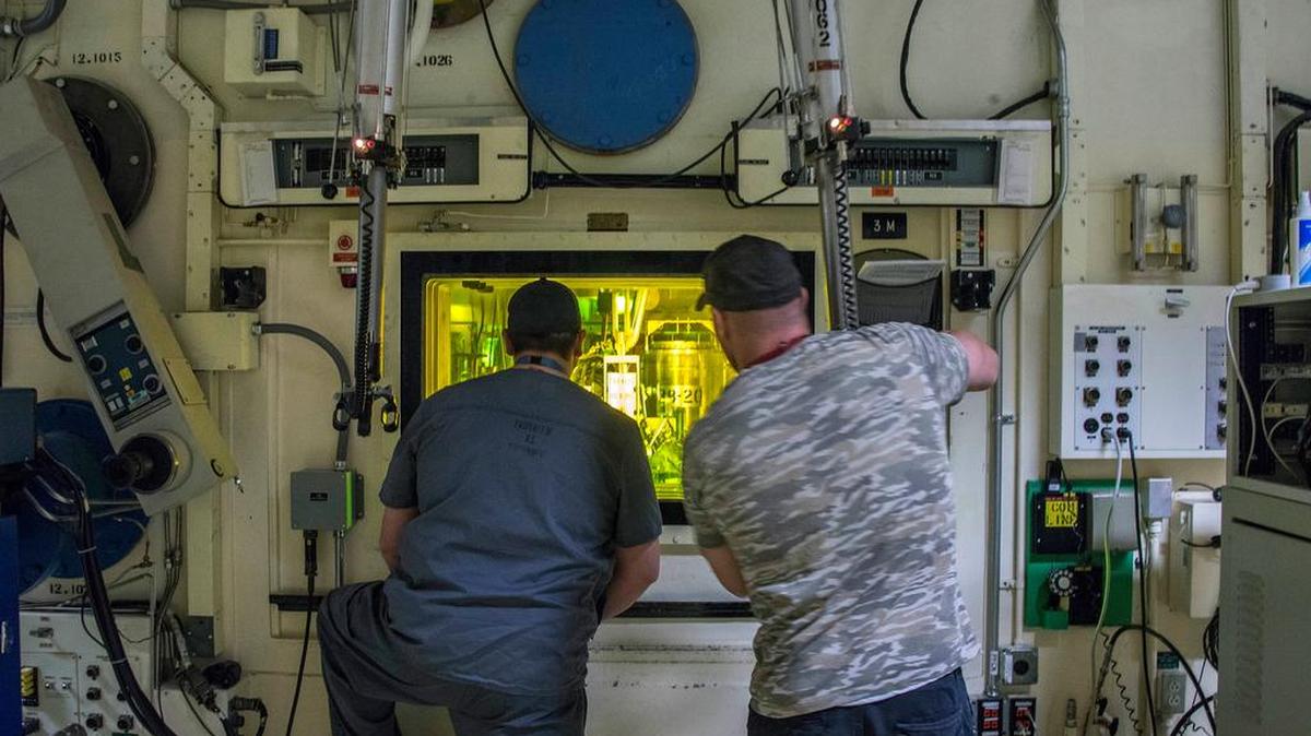Brian Simmons, right, and Freddy Rodriguez process nuclear operators at the Idaho National Laboratory using master-slave manipulators to work with radioactive material inside a hot cell that hasn’t been entered since 1974. Simmons was in the same accident with Ralph Stanton on Nov. 8, 2011, exposing him to alpha radiation-emitting americium and plutonium, which can be deadly when inhaled.