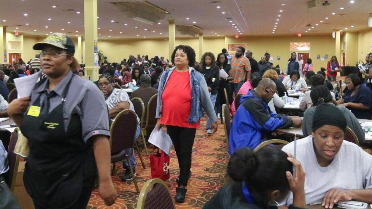 State Department of Social Services workers helped people affected by flooding in Columbia apply for food assistance Thursday at The Word of God Church and Ministries.