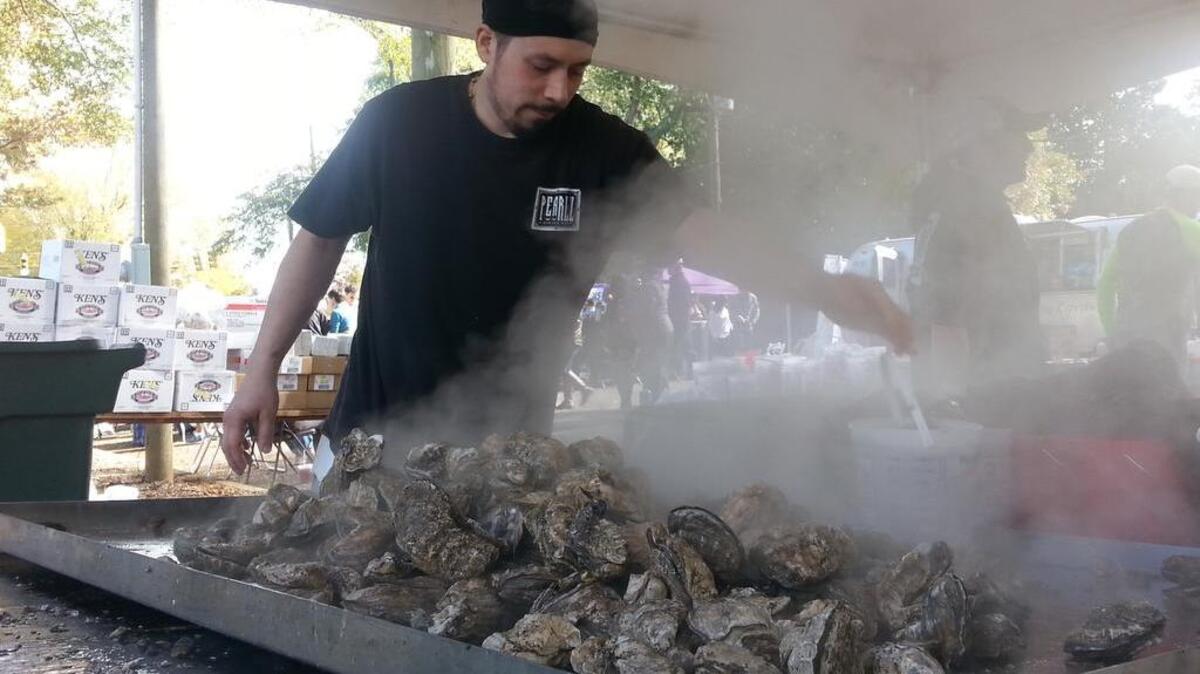 Warm weather and good food brought Columbia residents out to the 20th annual S.C. Oyster Festival Sunday. Here, the oysters are prepared.