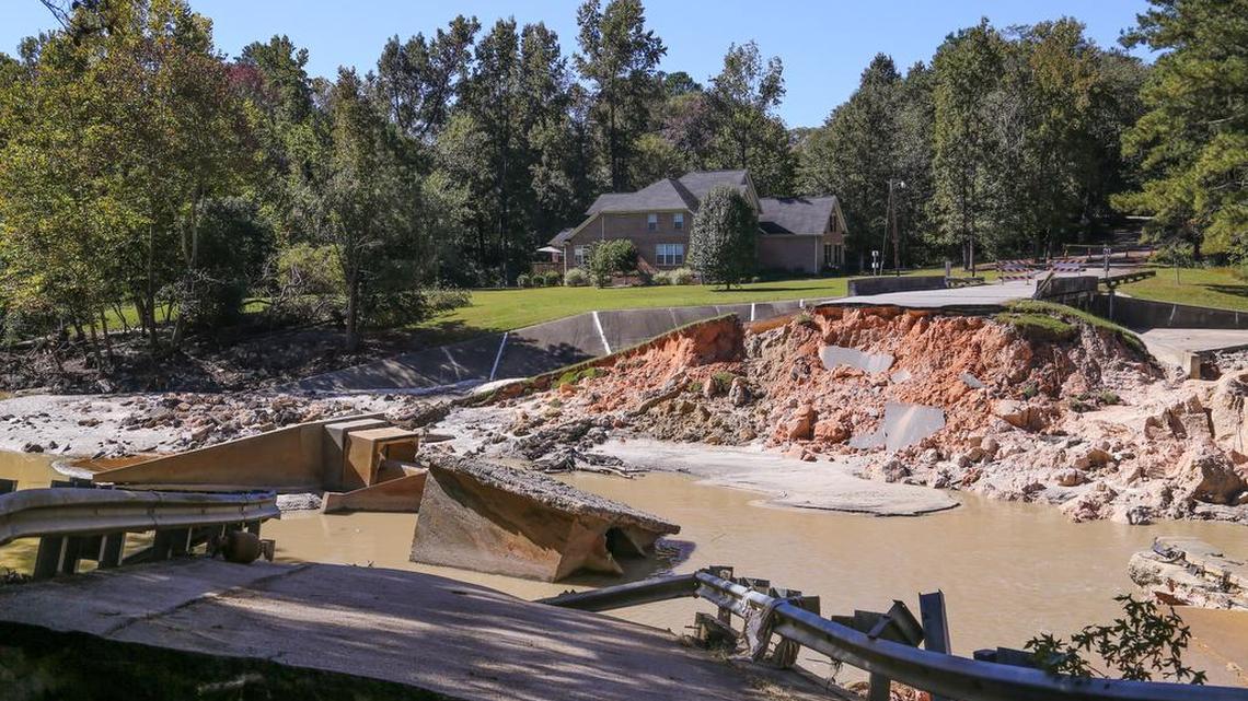 Cary Lake is nearly dry after heavy rains caused the dam to break.