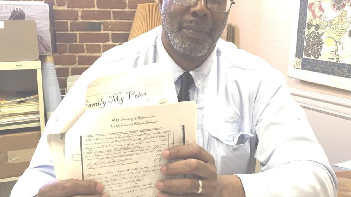 
National Sierra Club president Aaron Mair holds up documents showing his family’s South Carolina roots. He was in Columbia and Greenville for receptions. Mair’s ancestors are from the Pumpkintown area near the base of the Blue Ridge Mountains.
