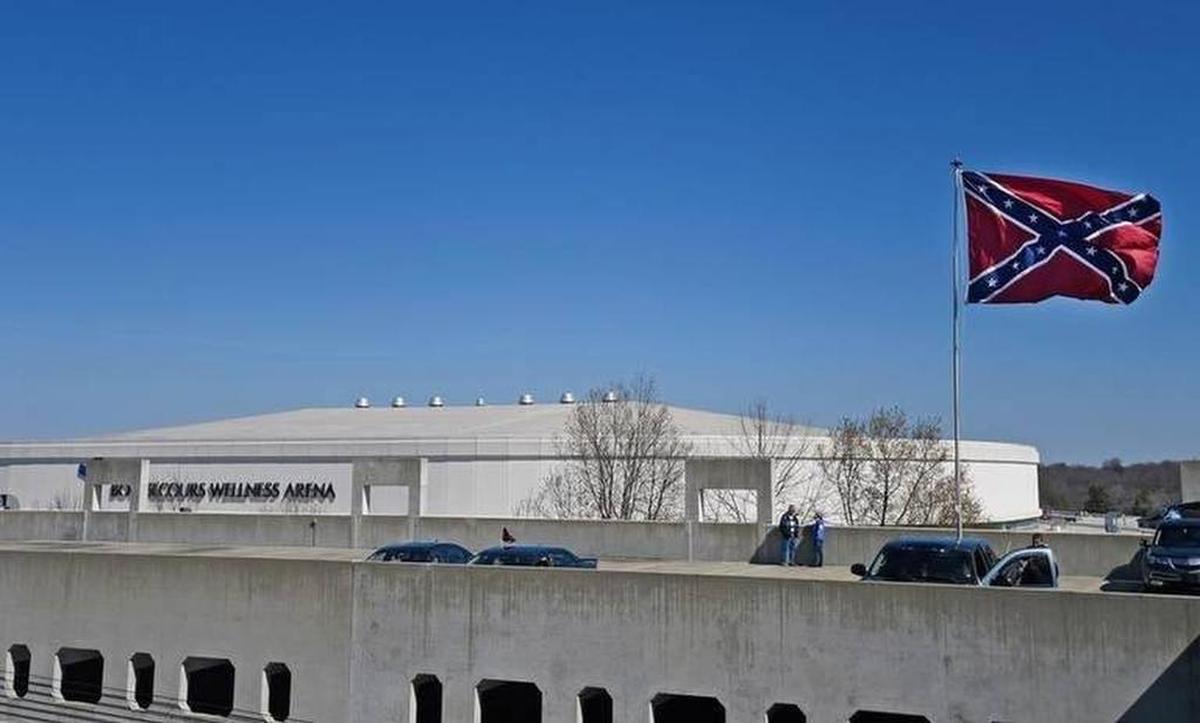 A Confederate flag flies from a parking deck outside the arena before a second-round game of the NCAA men's college basketball tournament in Greenville, S.C., Sunday, March 19, 2017. A small group of protesters flew a large Confederate flag from the top of a parking garage next to the arena hosting two men's NCAA Tournament games.