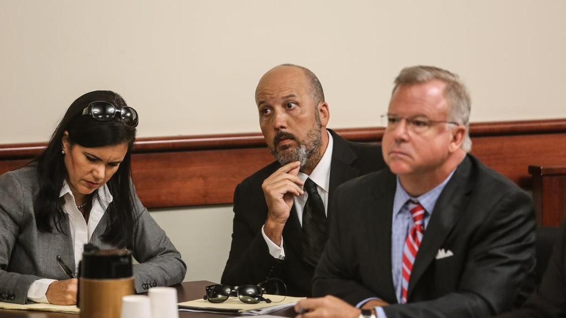 Will Folks, center, and his lawyers Rep. Mandy Powers Norrell, D-Lancaster, and former U.S. Attorney Pete Strom, attend a June 28 hearing on Folks’ confidential sources.