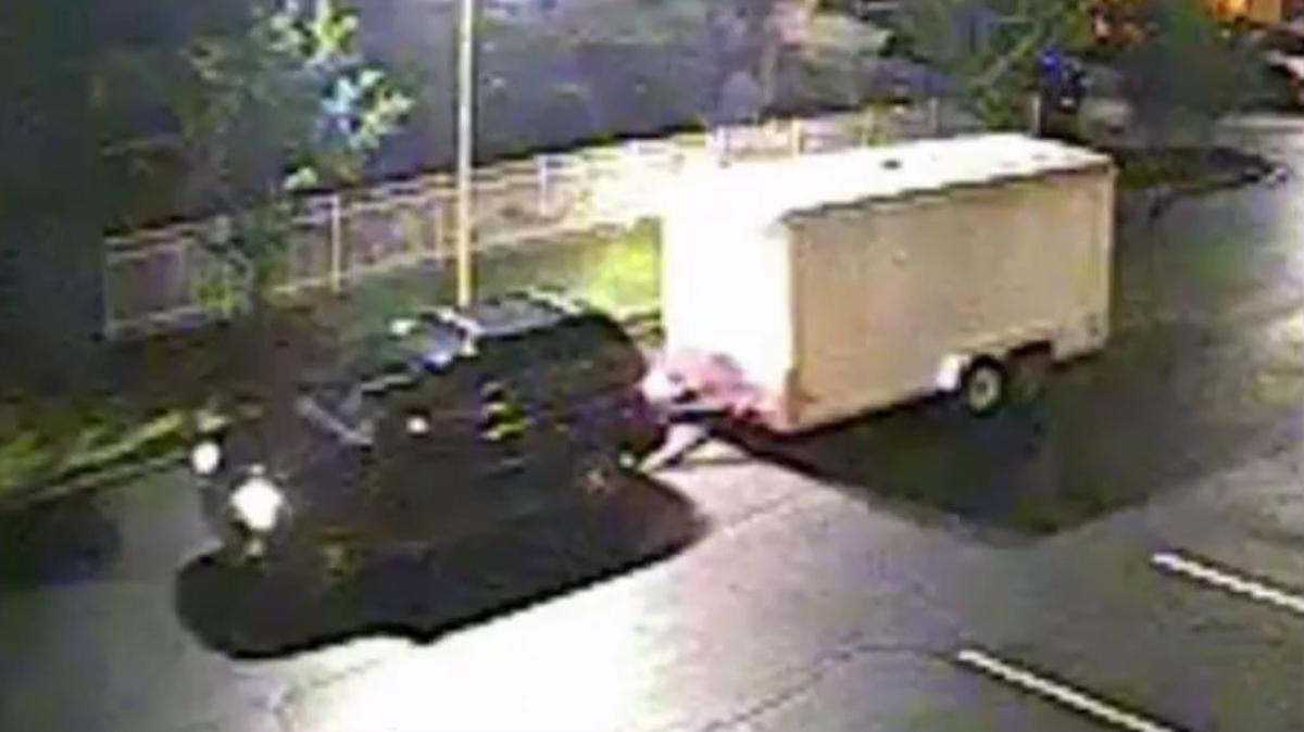 This still image from a surveillance video at Quality Inn on Two Notch Road shows a utility trailer being stolen.