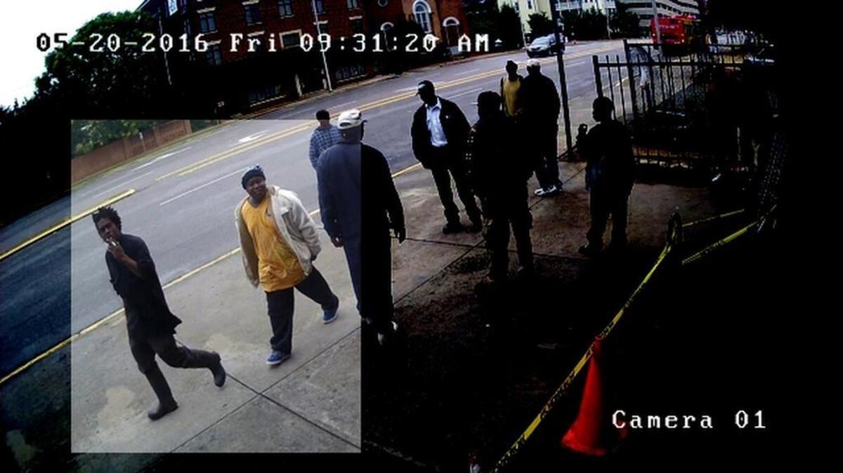 People of interest (man wearing yellow shirt and man smoking a cigarette and wearing water boots) sought in death of man.. whose body was found on Saturday.
