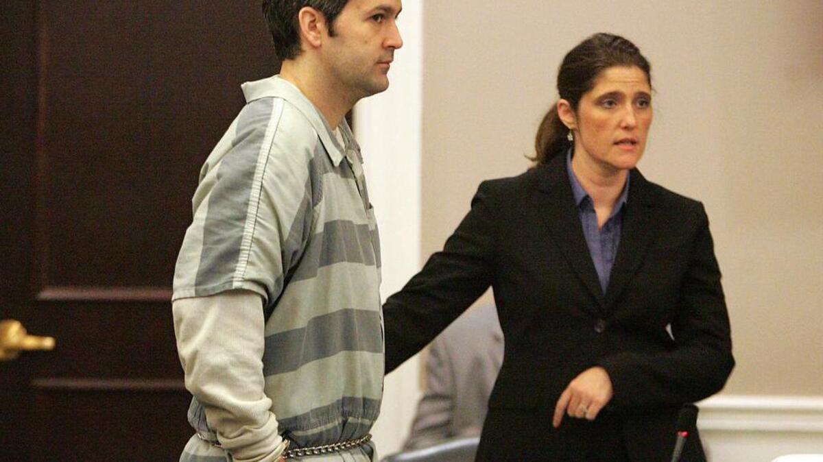 
Michael Slager, left, stands as one of his attorneys, Cameron Blazer, guides him toward the podium on Friday, Sept. 11, 2015 in Charleston, S.C. Slager is charged in the April 4 death of Walter Scott after a traffic stop. (Leroy Burnell/The Post And Courier via AP) MANDATORY CREDIT
