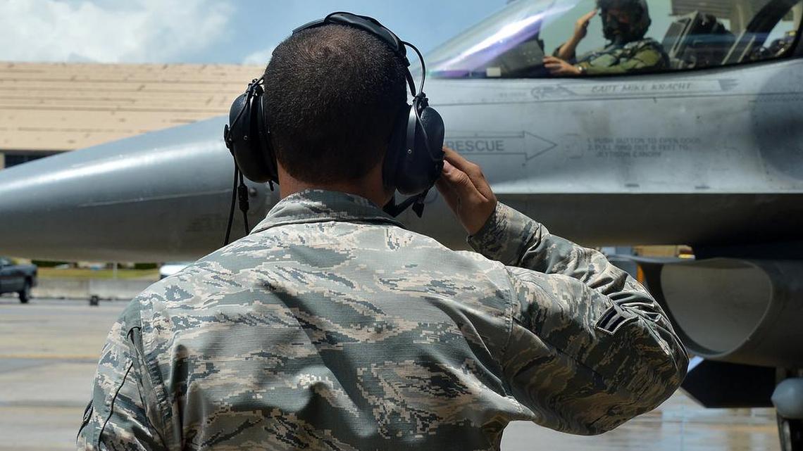 A U.S. Air Force Airman assigned to the 20th Maintenance Group salutes an F-16CM Fighting Falcon during the operational readiness exercise Weasel Victory 15-06 at Shaw Air Force Base May 27, 2015.