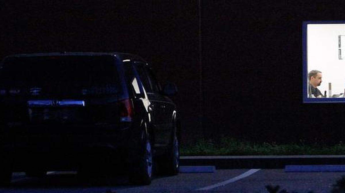 
A man works in a lit room as Bob Grabowski's vehicle is parked in the front of PTR Industries in Cool Spring on Tuesday, March 31, 2015. Grabowski was found dead of a self-inflicted gunshot wound in a field behind the gun manufacturing plant outside of Aynor on Tuesday afternoon, according to Capt. Dale Buchanan of Horry County Police. Grabowski was the vice chairman of the Horry County Council and represented of district 6. 
