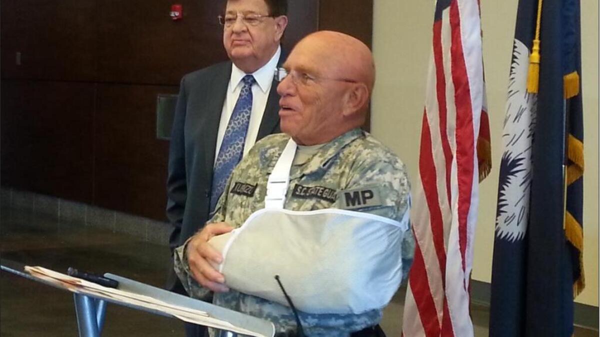 
S.C. guardsman Robert Kuenzli speaks to members of the press Monday after he was injured in a hit and run on Friday.
