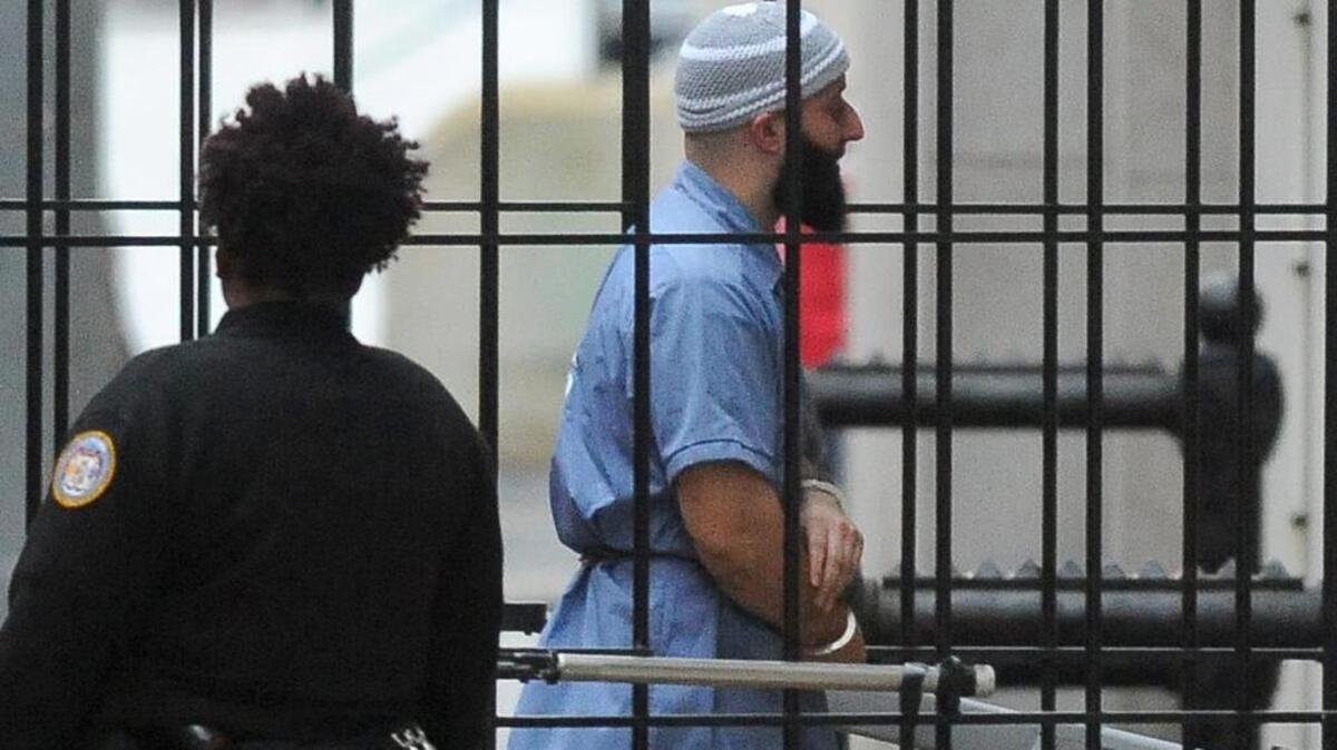 Adnan Syed enters Courthouse East in Baltimore prior to a hearing on Wednesday, Feb. 3, 2016 in Baltimore. The hearing, scheduled to last three days before Baltimore Circuit Judge Martin Welch, is meant to determine whether Syed's conviction will be overturned and case retried.