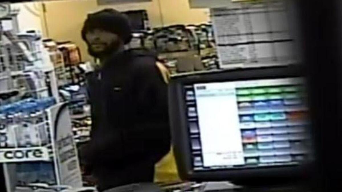 A surveillance camera captured a suspect in an armed robbery at a gas station on Greystone Boulevard.