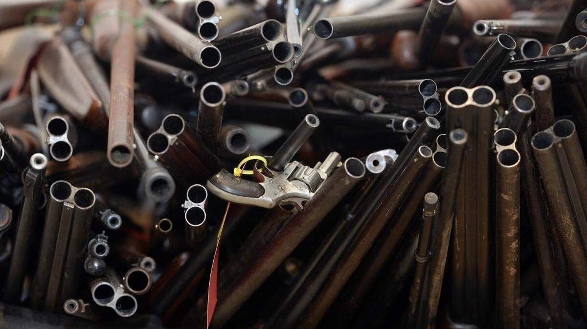 Firearms are stacked into a barrel after being cataloged at the Chesterfield County Sheriff's Department, in Chesterfield, S.C.