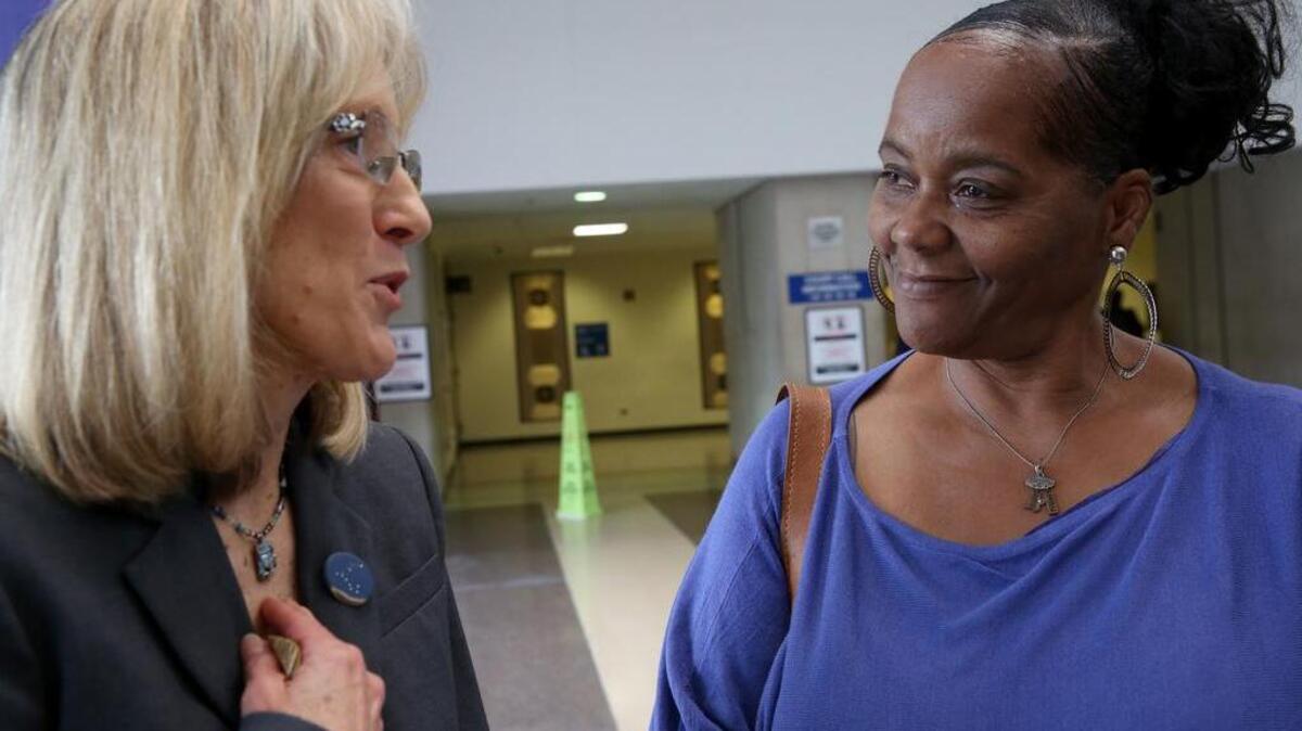 Judy Dugar, right, talks with her attorney Karen Daniel in the Leighton Criminal Courts Building on Thursday, Sept. 22, 2106 in Chicago. Dugar is the mother of identical twins Kevin Dugar and Karl Smith.