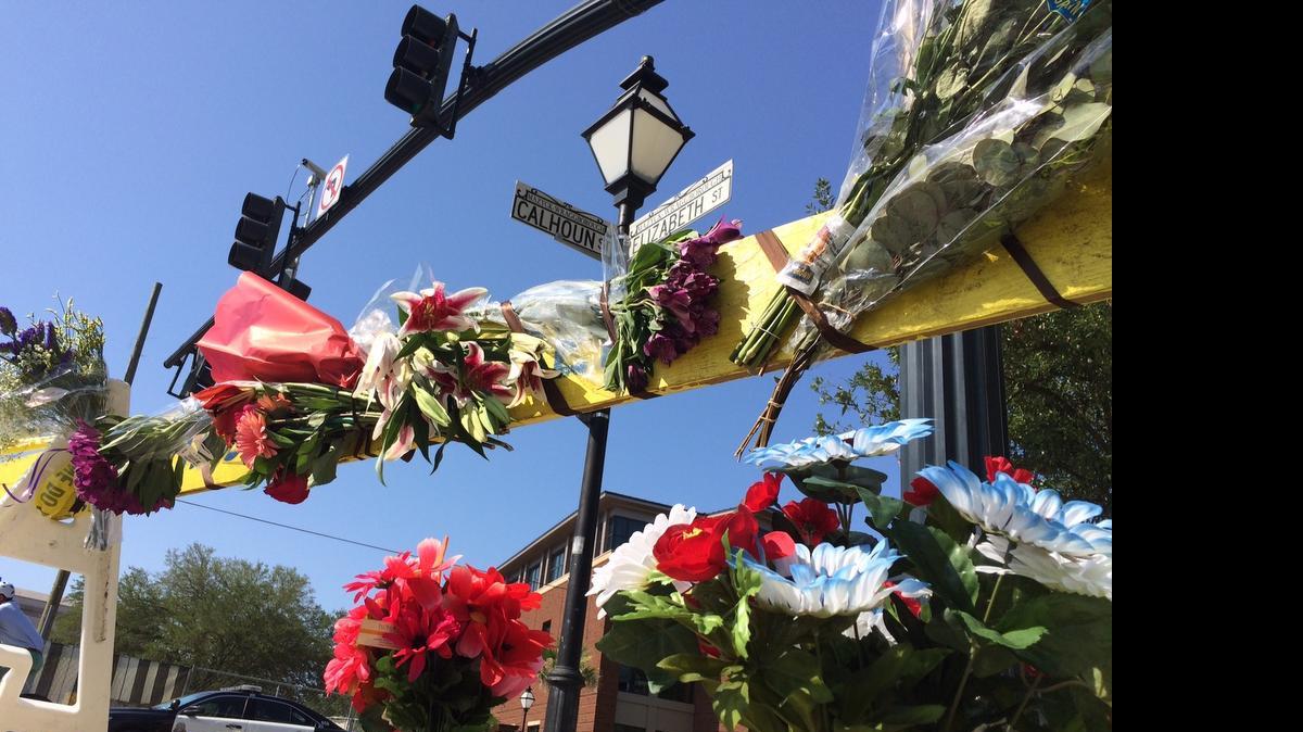 
Flowers were placed on a police barricade at Calhoun and Elizabeth Streets in Charleston.

