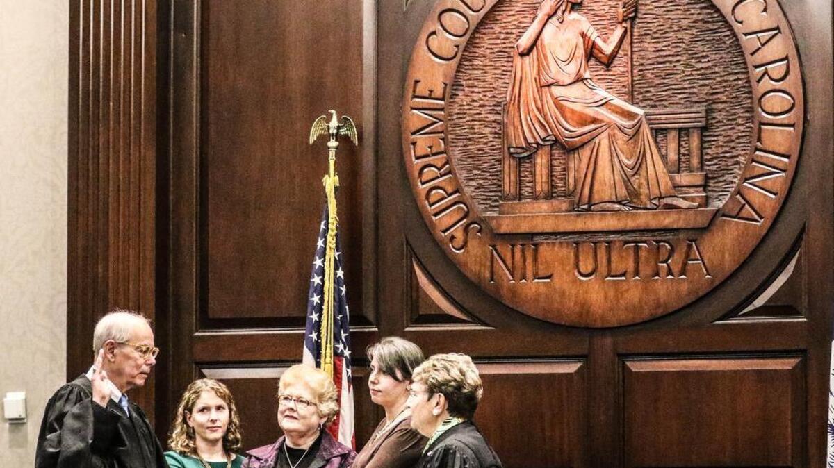Costa M. Pleicones, left, is sworn in Thursday as chief justice of the South Carolina Supreme Court by departing Chief Justice Jean Toal.