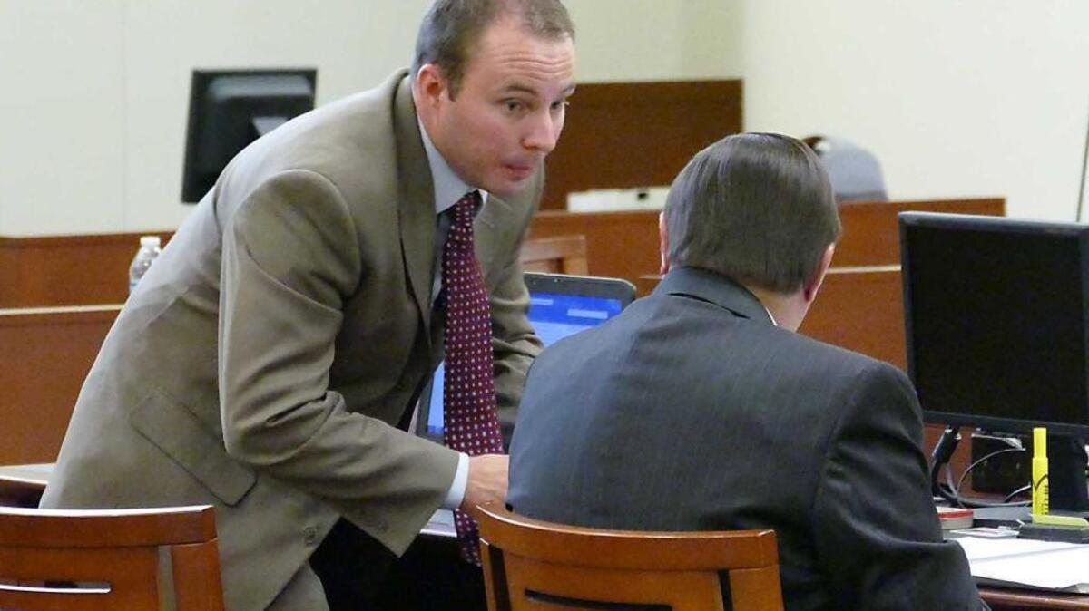 
Police officer Randall "Wes" Kerrick, left, talks with his attorney George Laughrun at the Mecklenburg County Courthouse in Charlotte, N.C. Friday, August 21, 2015. 
