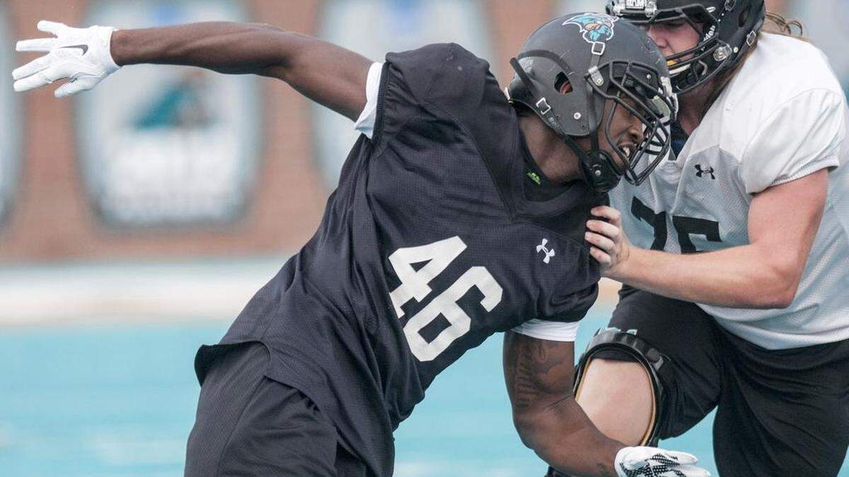 Miles White (46) was going to be a junior defensive end at Coastal Carolina this past season but he was dismissed from school after being charged with third degree criminal sexual conduct.