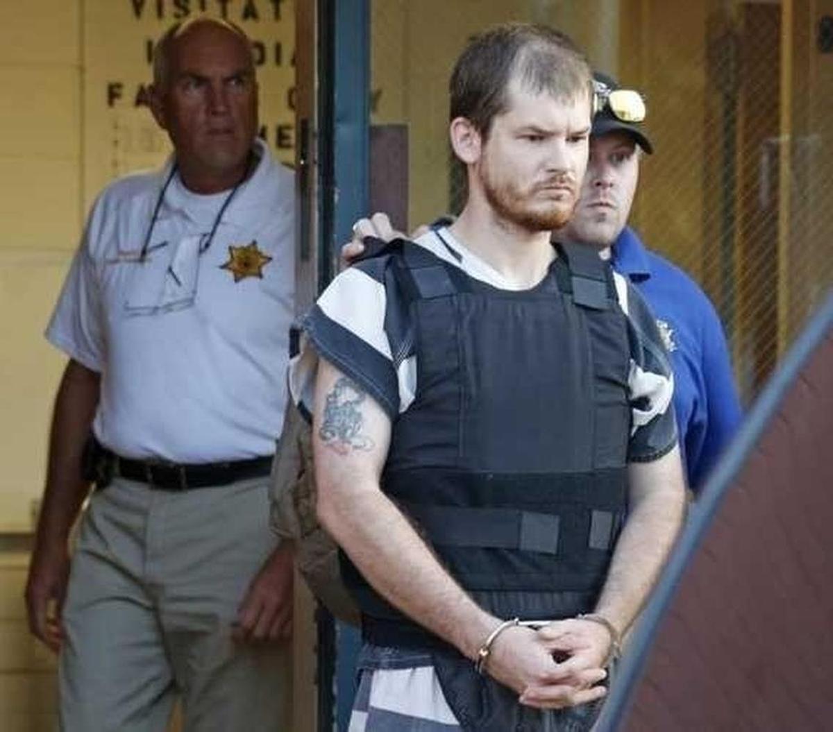 Timothy Ray Jones Jr., is escorted by lawmen out of the Smith County Jail to a vehicle for transport to Lexington County, S.C. on Thursday, Sept. 11, 2014.