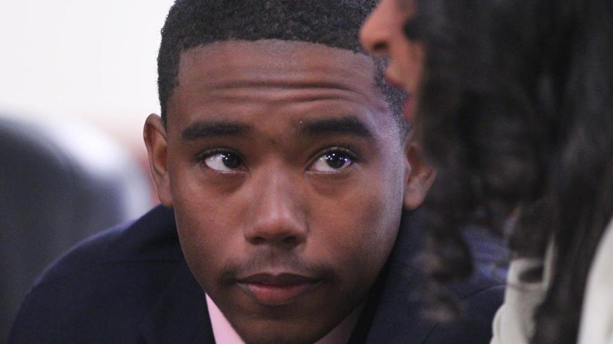 Kierin Dennis listens to his attorney, Simone Martin, during a hearing in Lexington in December 2014.