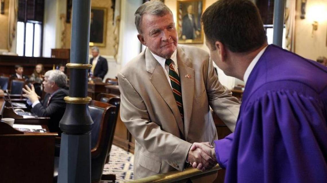 Suspended Sen. John Courson greets then-Lt. Gov. Ken Ard in the Senate chambers Aug. 25, 2011.