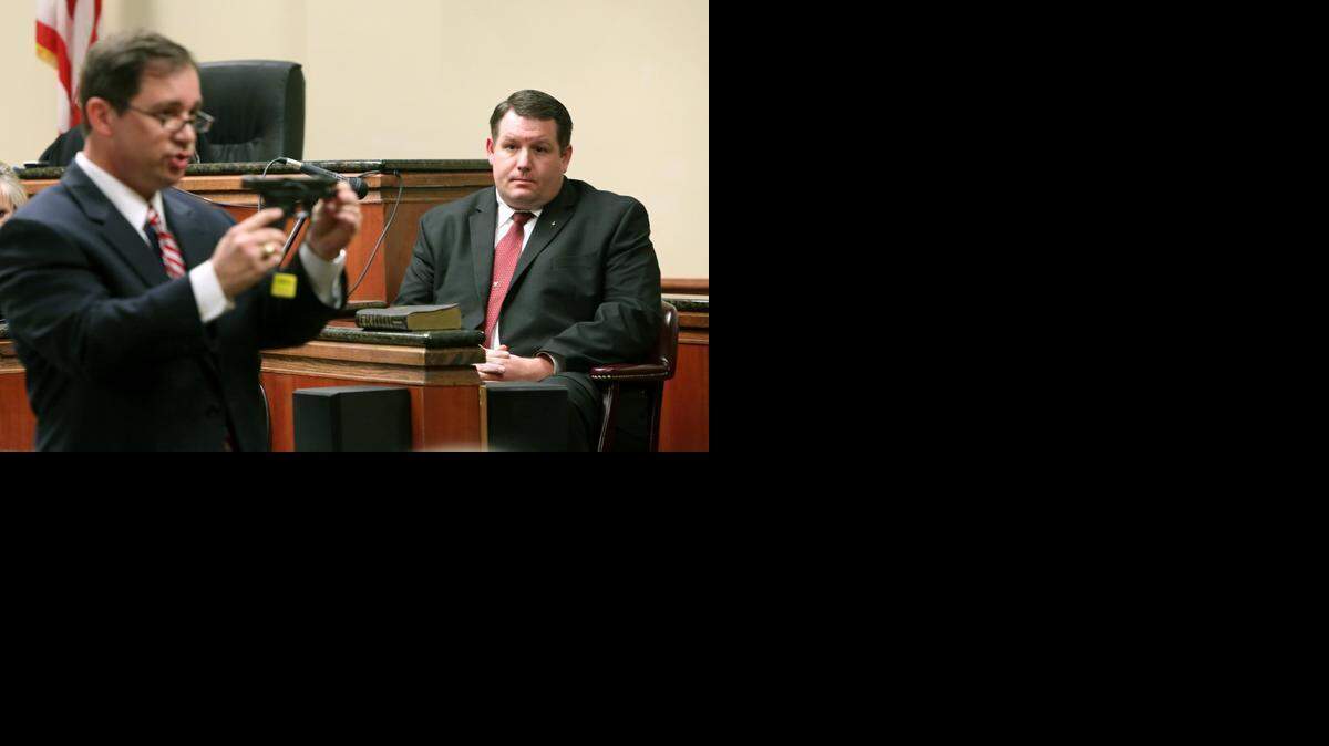 
Solicitor David Pascoe cross-examines former Eutawville police chief Richard Combs in January while holding the gun Combs used in the shooting death of Bernard Bailey, an unarmed black man, in May 2011. Pascoe said he intends to bring Combs to trial again after the jury announced it could not reach a decision and the judge declared a mistrial. 
