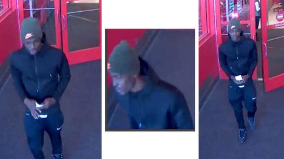 Surveillance photos of man wanted in connection to fraudulant purchases.