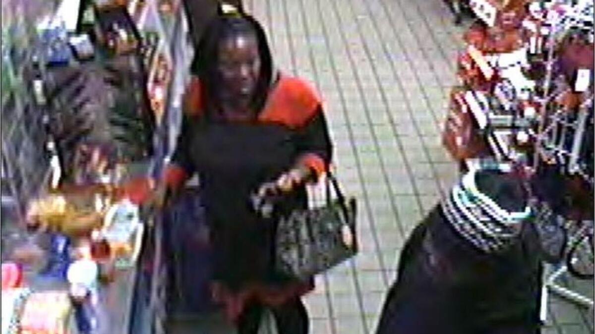 Surveillance photo of man and woman wanted in connection to a series of thefts in and around Lexington, between August and December 2016.