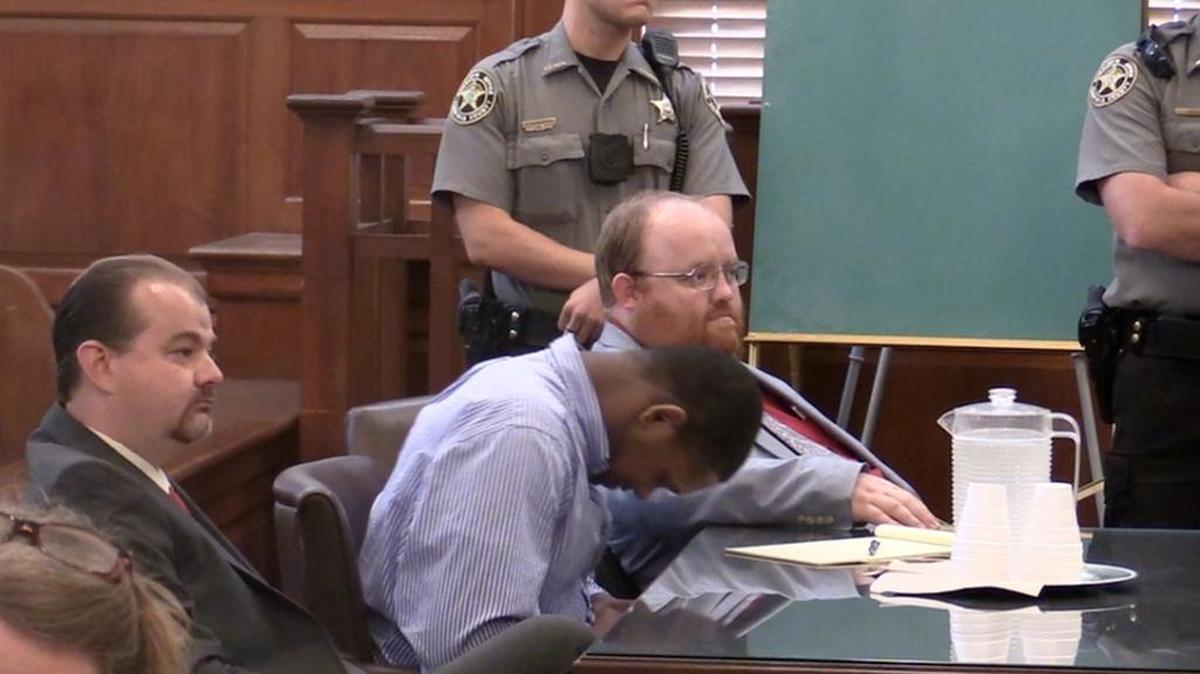 Chris Moore, center, appeared relieved after a jury deadlocked in his murder trial Saturday, forcing a mistrial. Moore is charged with fatally shooting Chester City Councilman Odell Williams in 2014.