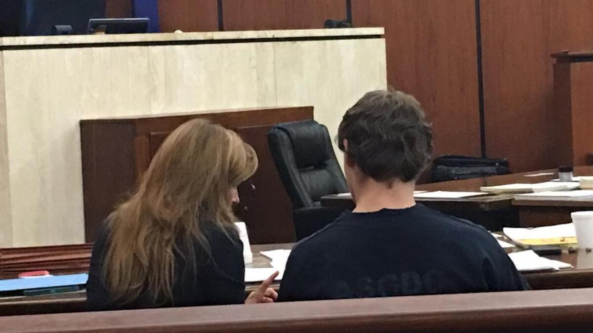 DJJ inmate Steven H., right, sits next to defense attorney Fielding Pringle.
