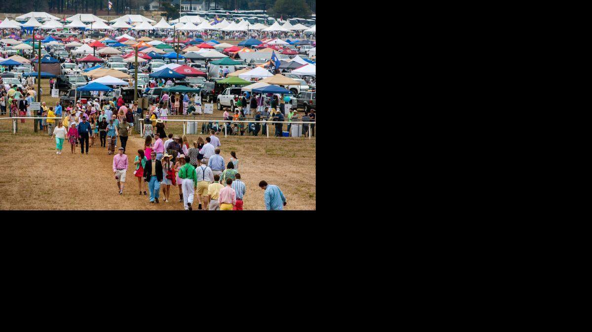 
Attendees cross the track between races at the 82nd Annual Carolina Cup at Springdale Race Course in Camden, SC. 
